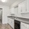 a kitchen with white cabinets