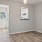 a room with a mirror and a wood floor