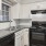 a kitchen with white cabinets