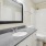 a bathroom with a large mirror