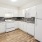 a kitchen with white cabinets