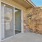 a brick building with a glass door